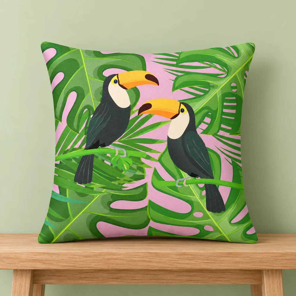 A bright tropical toucan pillow with leafy details